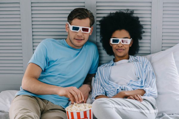 multiracial-couple-in-3d-glasses-watching-movie-at-2022-12-16-20-28-40-utc